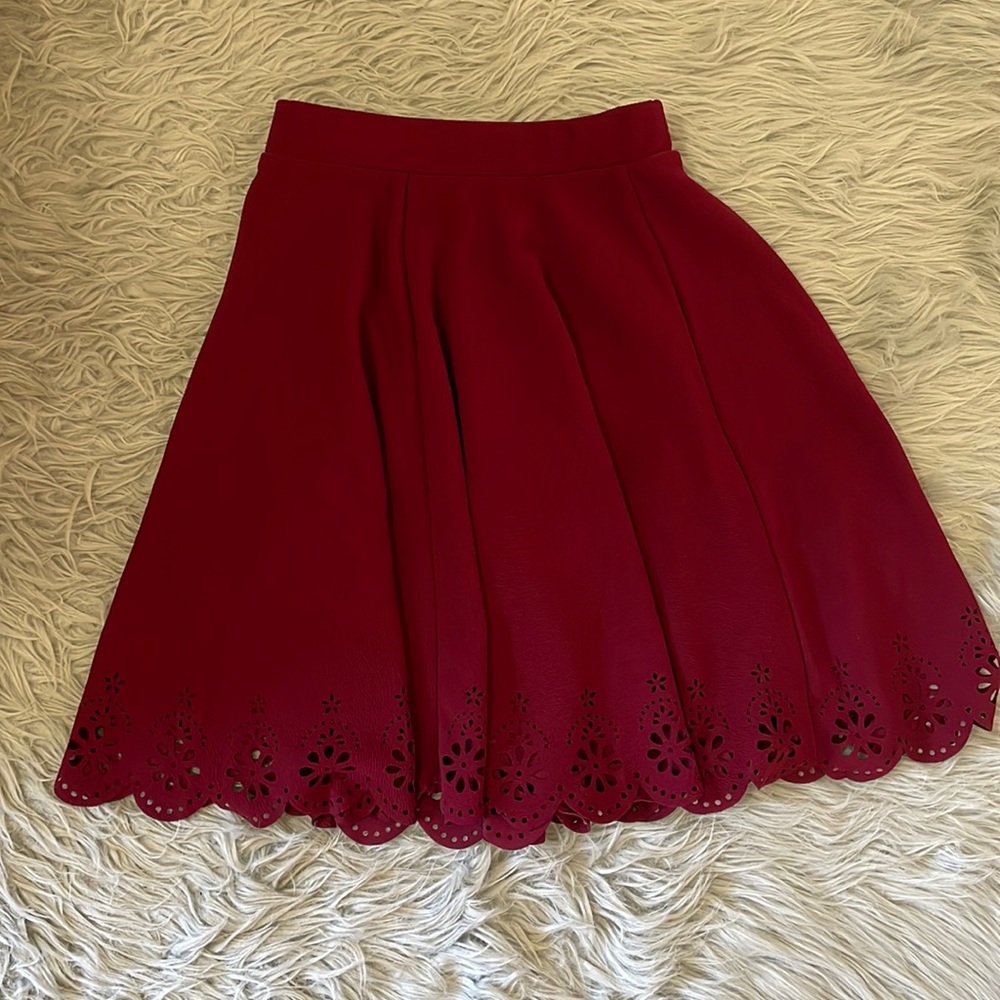 Maroon full skirt with scallop detail at hem